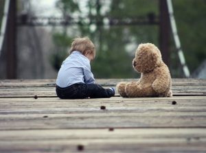 A sad child with his toy, children custody