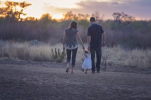 Parents and child walking together