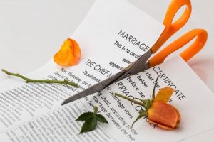 Scissors cutting divorce papers
