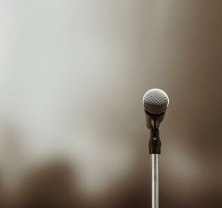 Microphone Public speaking background, Close-up the microphone on stand for speaker speech presentation