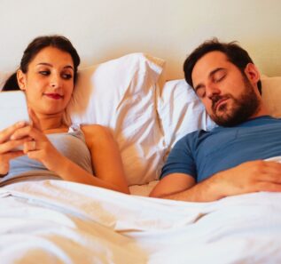 Woman liar having affair and chatting with other man while husband is asleep