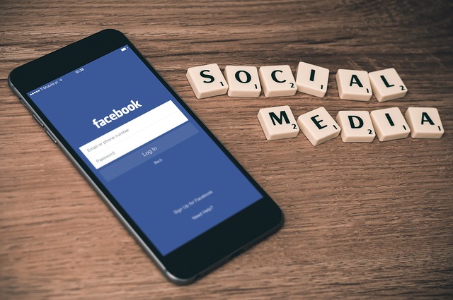 mobile phone and word social media spelled out in blocks