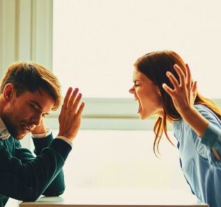 emotional man and woman sitting at the table conflict quarrel communication