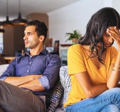 Young couple sitting on couch after a fight. date during a divorce