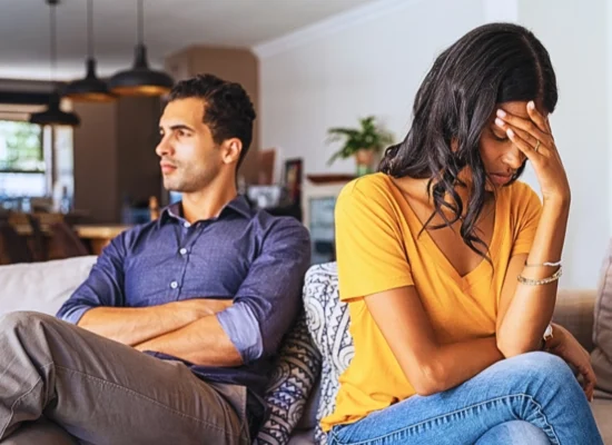 Young couple sitting on couch after a fight. date during a divorce