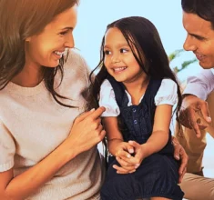 Happy mother, father and daughter playing at home. Updating Your Parenting Plan for School