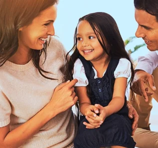 Happy mother, father and daughter playing at home. Updating Your Parenting Plan for School