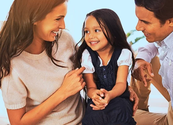 Happy mother, father and daughter playing at home. Updating Your Parenting Plan for School