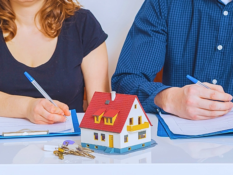 Man and woman are signing divorce agreement. Dividing Stock Options & RSUs